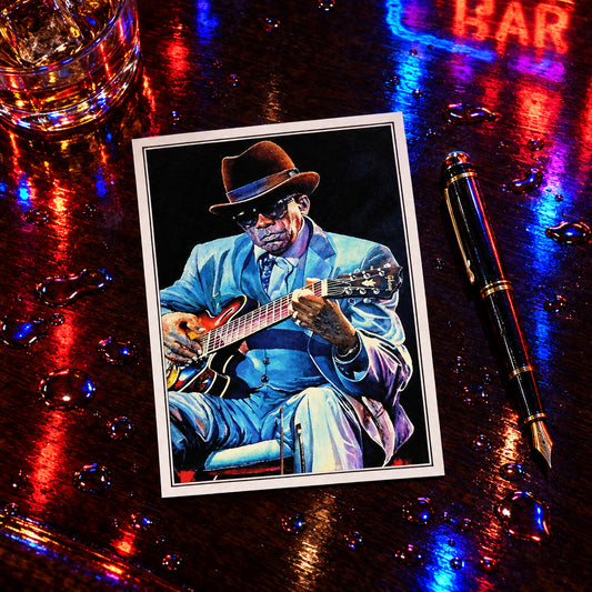 A colorful painted portrait of a man in a brown fedora, dark sunglasses, a light blue suit, and a guitar, shown as wall art against a gray gradient background.