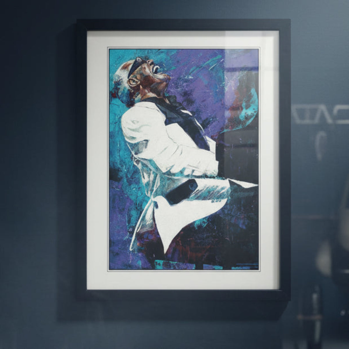 Framed abstract portrait print of Ray Charles playing a piano, featuring bold blue, purple, black, and white brushstrokes, presented in a black frame.