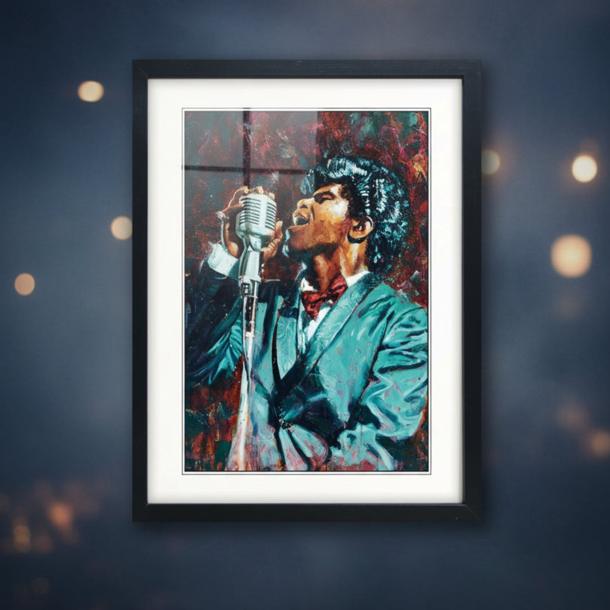 Framed canvas wall art featuring a colorful painted portrait of a male singer holding a vintage microphone, shown in a black frame with white matting against a light gray background.