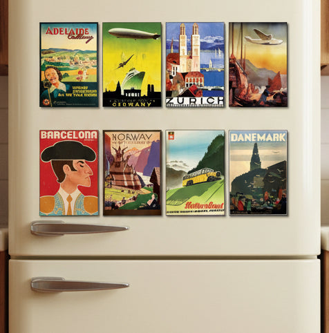 A set of eight vintage travel poster prints arranged in two rows on a gray gradient background. The posters feature retro designs with destinations and scenes including Adelaide, Germany, Zurich, Barcelona, Norway, Switzerland, and Denmark.