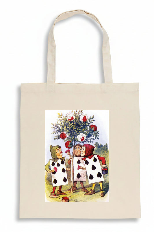 A natural canvas tote bag featuring a printed illustration of two children dressed as playing cards under a tree of red apples, shown against a plain white background.