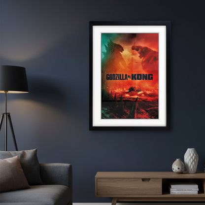A framed Godzilla vs Kong movie poster hanging on a dark navy wall in a modern living room setting with a gray sofa, wooden console table, and a black floor lamp.