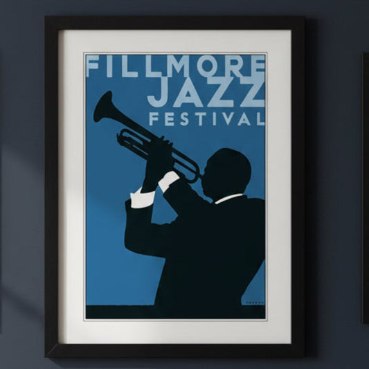 Framed art print featuring a stylized illustration of a trumpet player in a black silhouette against a blue background, with the text 'FILLMORE JAZZ FESTIVAL' in white. The print is matted with a white border and enclosed in a black frame.