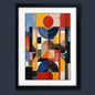 Framed abstract geometric art print featuring a colorful collage of circles, rectangles, and blocks in red, yellow, blue, black, and white, presented in a black frame with a white mat against a light gray background.