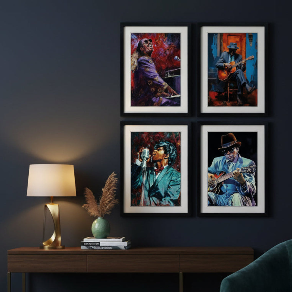 Dark blue wall with a collection of four black framed prints of blues and rock musicians hanging 