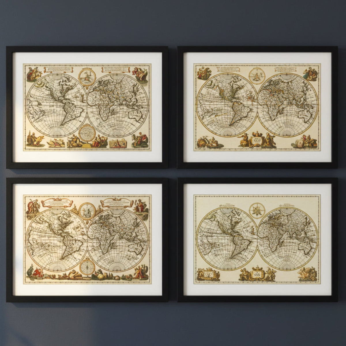 Four framed vintage world maps arranged in a 2x2 grid on a dark gray wall. Each map features an antique double-hemisphere world design with cream backgrounds, detailed sepia linework, and small decorative illustrations, enclosed in black frames with white matting.