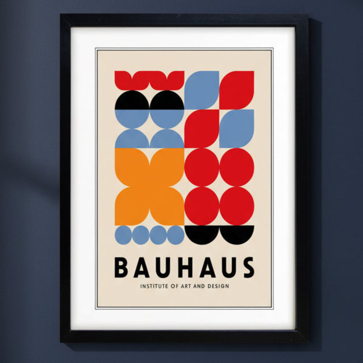 A framed Bauhaus poster featuring a mid-century modern geometric design with red, orange, blue, black, and beige shapes, enclosed in a black frame with a white mat.