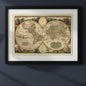 A framed vintage double-hemisphere world map print with an ornate black frame and white mat, shown against a plain white background.