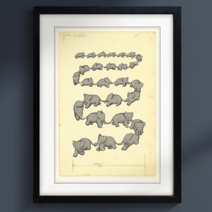 A framed art print featuring a vintage scientific illustration of elephant embryos arranged in wavy rows on a pale yellow background, enclosed in a black frame with a white mat.
