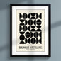 Bauhaus print hung on dark blue wall  natural sunlight 