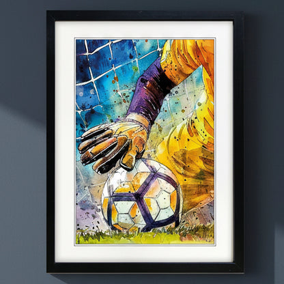 Framed watercolor art print of a soccer goalkeeper in a yellow jersey touching a soccer ball, presented in a black frame with a white mat on a white background.