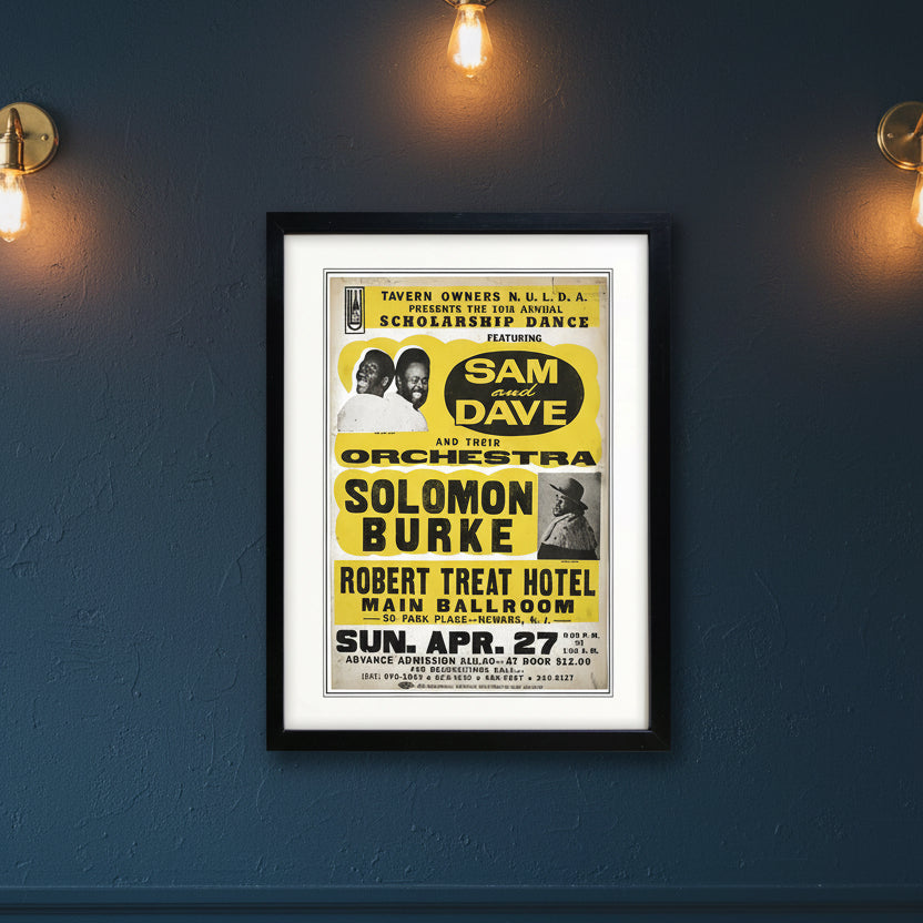 A framed vintage concert poster for 'Sam and Dave' and 'Solomon Burke' with bold yellow and black text, shown against a plain white background.