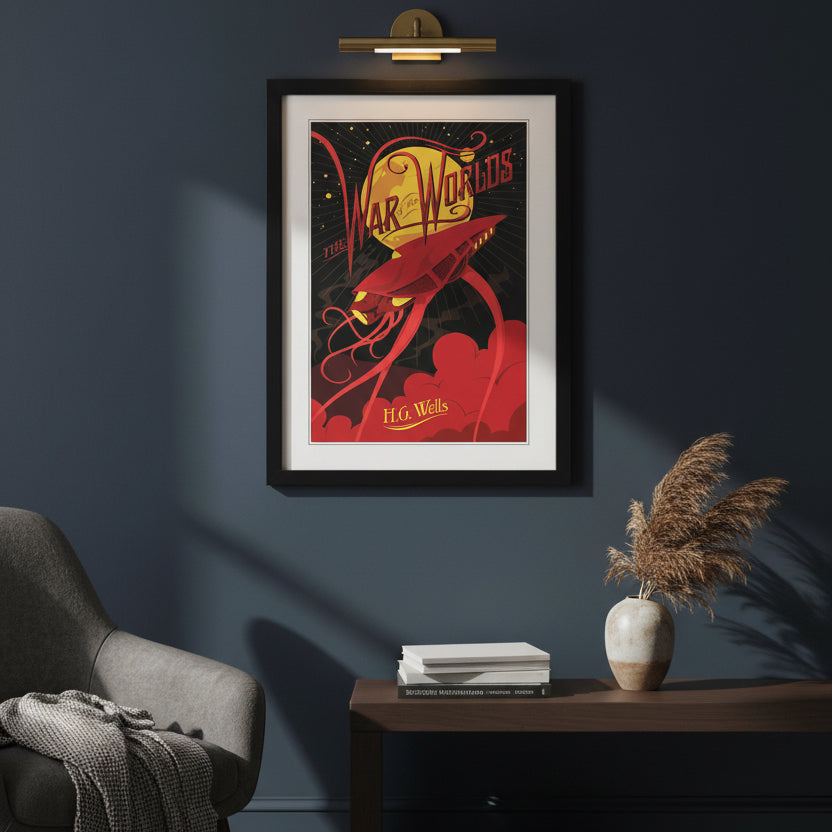 A framed art print of H.G. war of the worlds book cover print in a black frame on white wall