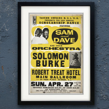 A framed vintage concert poster for Sam and Dave and Solomon Burke, featuring bold yellow text blocks, black typography, and a black frame with a white mat on a light background.