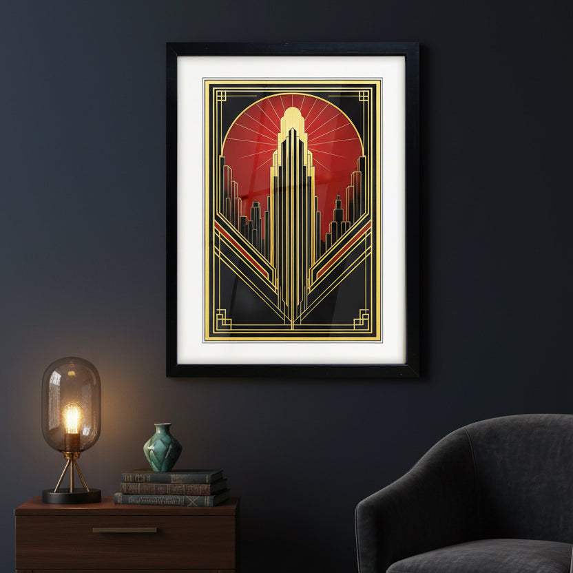 Framed art print featuring an Art Deco style illustration of a skyscraper and city skyline in black, gold, and red, shown with a white mat and black frame on a white background.