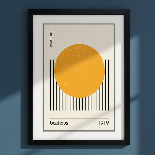 Bauhaus print on blue wall in black frame with white mount