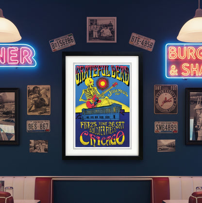 A framed Grateful Dead concert poster featuring a skeleton playing a red guitar under a yellow sun, with text reading 'Grateful Dead', 'Steve Miller', and 'Chicago' on a white background.