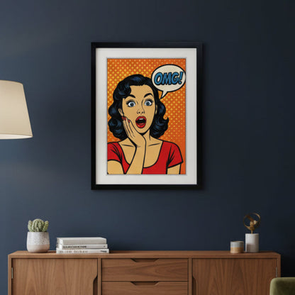 Framed pop-art style wall art featuring a surprised woman with dark wavy hair, a red top, and an orange halftone background, with a speech bubble reading OMG! in blue.