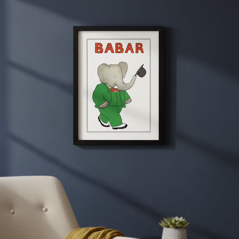 Framed Babar elephant poster featuring the character in a green suit with a red bow tie and black hat, with the word 'BABAR' in red at the top, shown in a black frame on a white background.