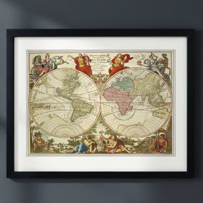 A framed vintage world map print with a black frame and white mat, showing two large hemispheric maps with decorative classical figures and pastel-colored landmasses.