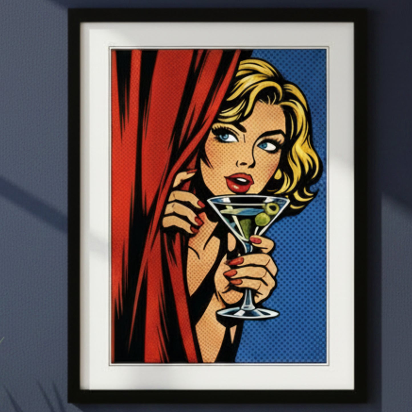 Framed pop-art style print featuring a blonde woman peeking from behind a red curtain and holding a martini glass with olives, set against a blue halftone background. The artwork is shown in a black frame with a white mat on a white background.