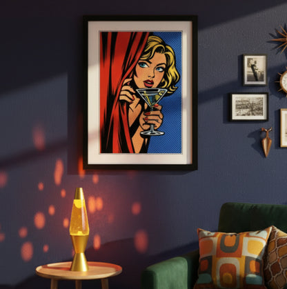 Framed pop-art style print featuring a blonde woman peeking from behind a red curtain and holding a martini glass with olives, set against a blue halftone background. The artwork is shown in a black frame with a white mat on a white background.