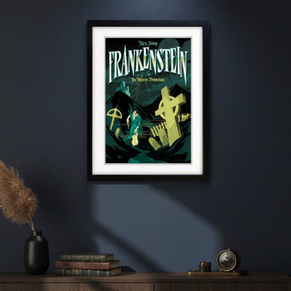 A framed gothic movie poster for 'Frankenstein: The Modern Prometheus' starring Mary Shelley, featuring a stylized illustration of a figure in a green coat in a graveyard with tombstones under a dark teal sky, presented in a black frame with a white mat.