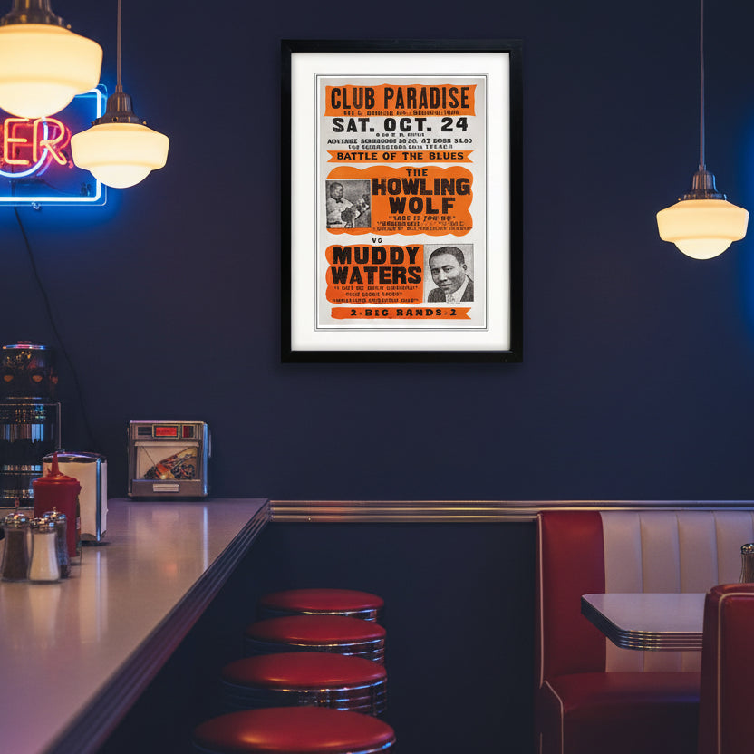A framed vintage-style concert poster for Club Paradise, featuring orange and black text with photos of performers, displayed against a white background with a black frame.