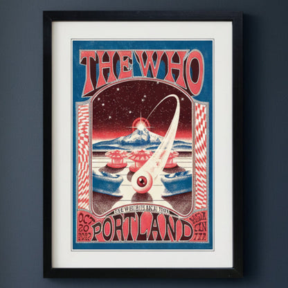 A framed vintage-style concert poster for The Who's 'Portland' show, featuring red, cream, and blue artwork with a black frame on a dark blue back ground.