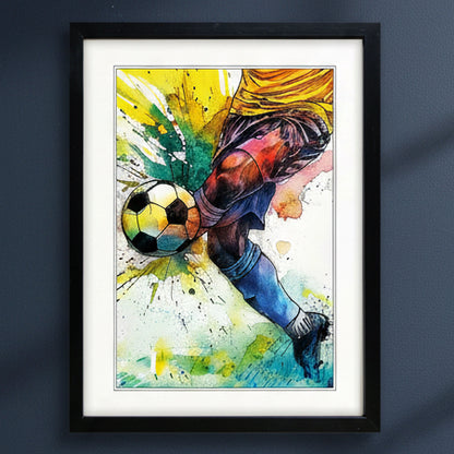 Framed watercolor soccer art print featuring a dynamic leg kicking a soccer ball, displayed on a dark gray wall.