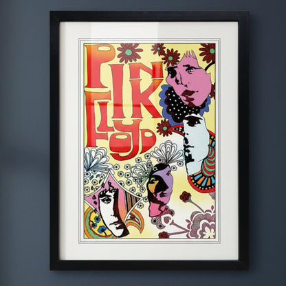 A framed art print featuring a retro, psychedelic illustration with bold red letters, displayed on a dark gray wall.