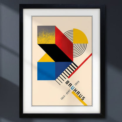 Framed Bauhaus art print featuring a geometric abstract design in red, yellow, blue, black, and beige, with the text 'BAUHAUS' and dates '1913 - 1929' in a minimalist style.