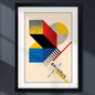 Framed Bauhaus art print featuring a geometric abstract design in red, yellow, blue, black, and beige, with the text 'BAUHAUS' and dates '1913 - 1929' in a minimalist style.