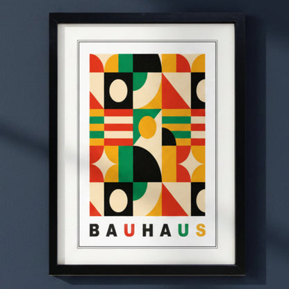 A framed Bauhaus art print featuring a colorful geometric pattern with the word 'BAUHAUS' at the bottom. The black framed Print is in a dark blue background or wall.