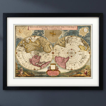 Antique reproduction world atlas map in black frame with white mount on a blu wall with natural lighting 