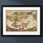 Antique reproduction world atlas map in black frame with white mount on a blu wall with natural lighting 