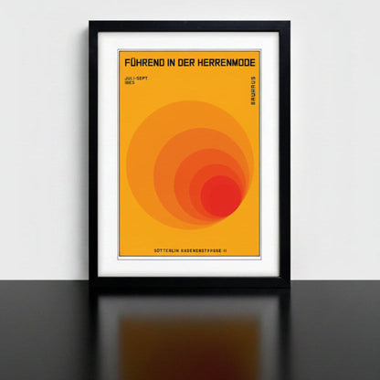 A framed Bauhaus poster print featuring a retro-style orange and red concentric circle design with German text, shown in a black frame against a white background.