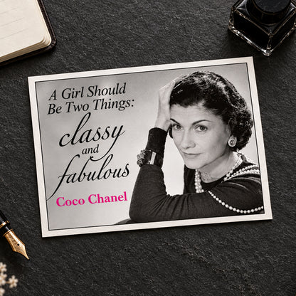 A black-and-white portrait of Coco Chanel with the text 'A Girl Should Be Two Things: classy and fabulous Coco Chanel' in black and pink lettering on a light gray background.