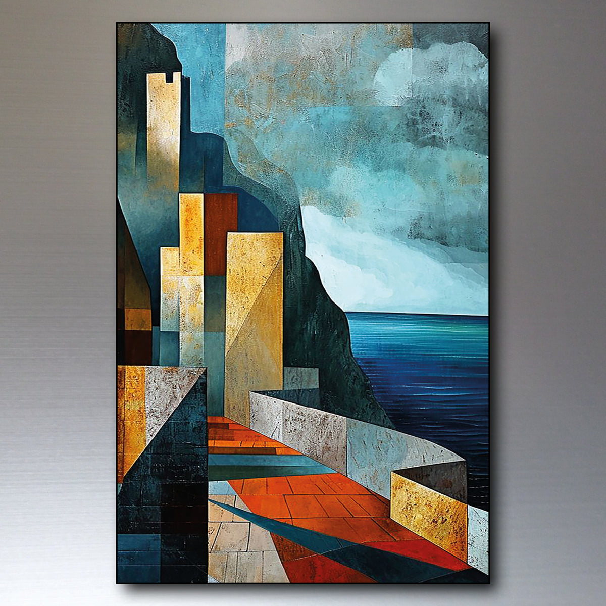 An abstract geometric painting depicting a coastal scene with blue water, a rocky cliff, and angular buildings in shades of blue, teal, gold, red, and gray, shown hanging against a gray wall.