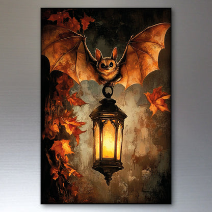 A vertical wall art print or poster showing a bat with spread wings perched on a glowing lantern, surrounded by orange autumn leaves against a dark textured background, displayed on a gray wall.