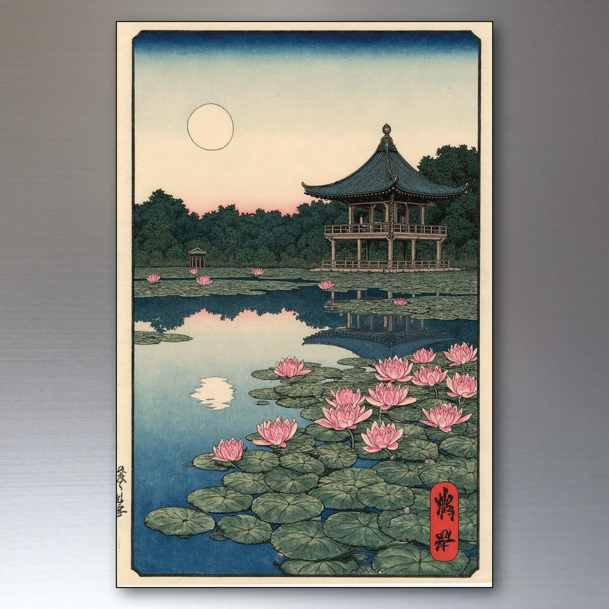 A framed Japanese-style art print depicting a serene pond scene at dusk, with pink lotus flowers, green lily pads, a pagoda pavilion, trees, and a pale moon in a blue sky. The print is shown against a neutral gray background.