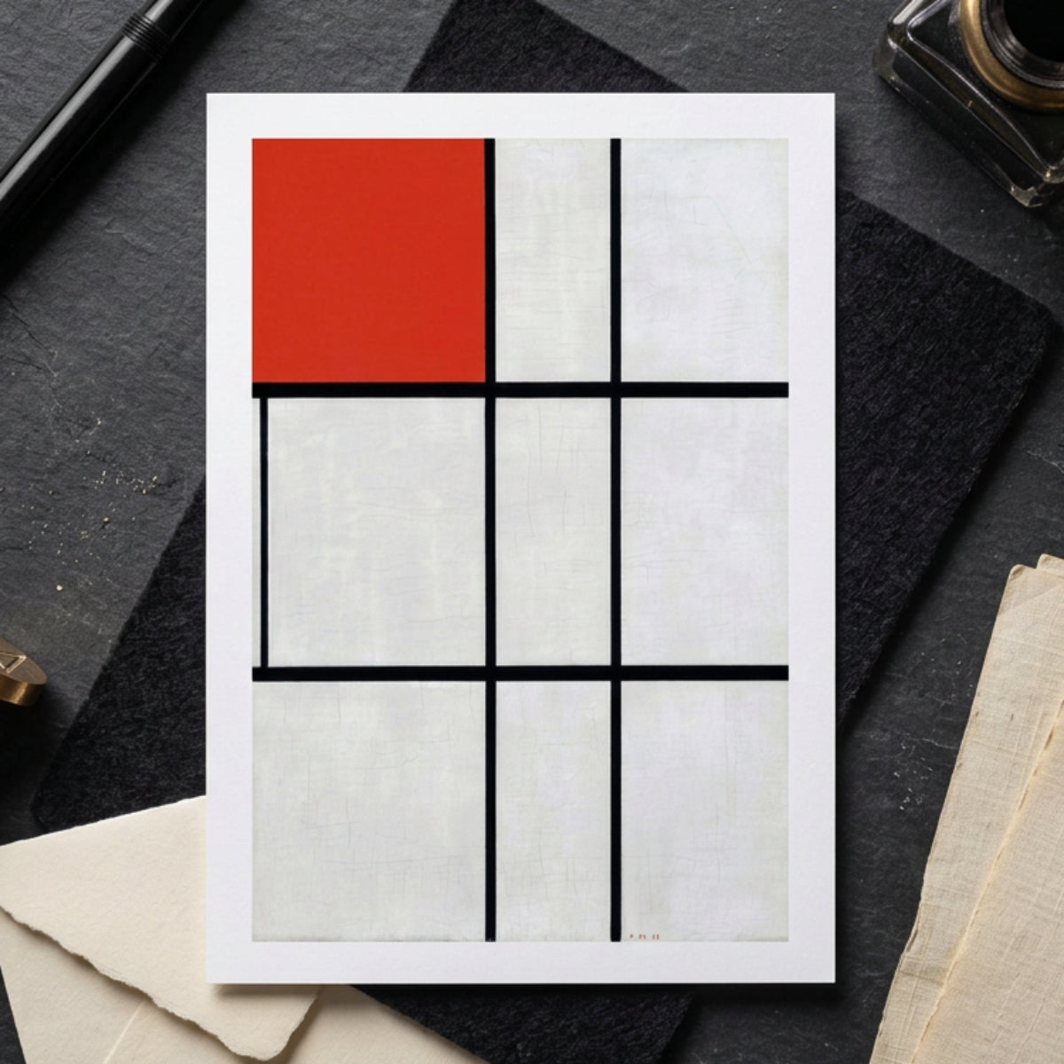 A square abstract geometric wall art print featuring a white grid with thick black lines and a solid red square in the top-left cell, shown against a neutral gray gradient background.