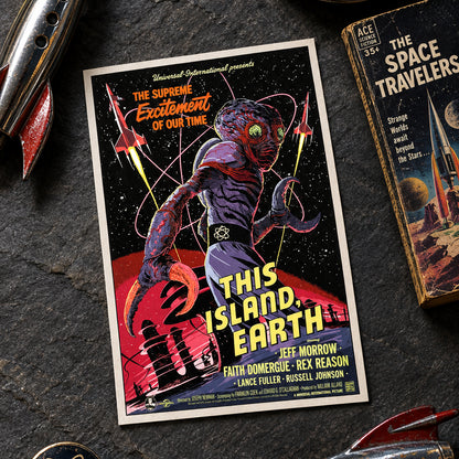 A retro sci-fi movie poster for 'This Island Earth' displayed on a metallic gray wall. The poster features a large, muscular alien with green eyes and clawed hands, surrounded by rockets and stars, with bold yellow title text.