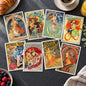 A set of eight vintage-style Art Nouveau posters arranged in two rows on a plain white background. The posters feature colorful illustrations with French text, including designs for Chocolat Ideal, Bieres de Meusne, Le Triomphe de l'Orient, Le Goulou de la Metropole, Pétrole Hànn, Ambassadeurs des Coeurs, Fleury Cétes, and Ambition Universelle.