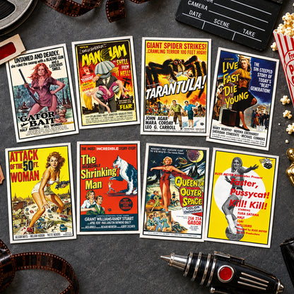 A set of eight vintage-style movie posters arranged in a 3-by-3 grid on a black background. The posters feature classic cinematic artwork with bold titles including Gator Bait, Man-Lam, Tarantula!, Live Fast Die Young, Attack of the 50th Woman, The Shrinking Man, Queen of Outer Space, and Gaster, Pussycat! Will Kill.