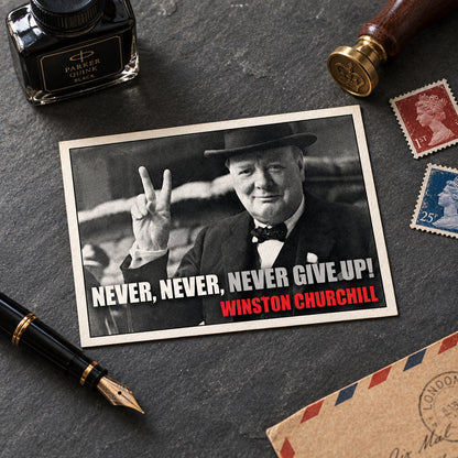 A framed poster print featuring a black-and-white portrait of Winston Churchill raising the peace sign, with the text 'NEVER, NEVER, NEVER GIVE UP!' in white and 'WINSTON CHURCHILL' in red at the bottom, shown against a gray gradient background.