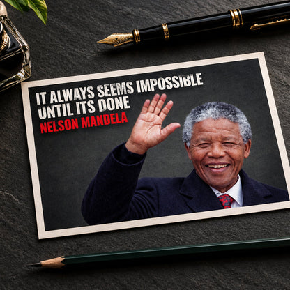 A framed poster featuring a smiling Nelson Mandela waving, with the text 'IT ALWAYS SEEMS IMPOSSIBLE UNTIL ITS DONE' in white and 'NELSON MANDELA' in red. The poster is shown against a gray gradient background.