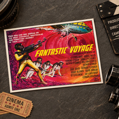 A vintage-style movie poster for 'Fantastic Voyage' is displayed in a styled flat-lay with film reels, clapperboard, camera, and cinema tickets on a dark textured surface.