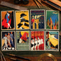 A set of eight vintage-style travel poster prints arranged in a 2x4 grid on a white background. The posters feature retro Art Deco designs with illustrations of figures, trains, airplanes, and cityscapes, including titles such as Folkestone by Rail, Orient Line Cruises, The Teleportation Accident, and Monte-Carlo.