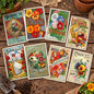 A set of eight vintage-style flower seed garden label cards arranged in two rows of four on a plain white background. The cards feature colorful illustrations of flowers, seed names, and decorative text from different periods, including Burpee's, Cole's, and Richard Mitnick.